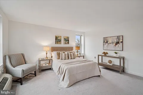 a bedroom with a bed and furniture