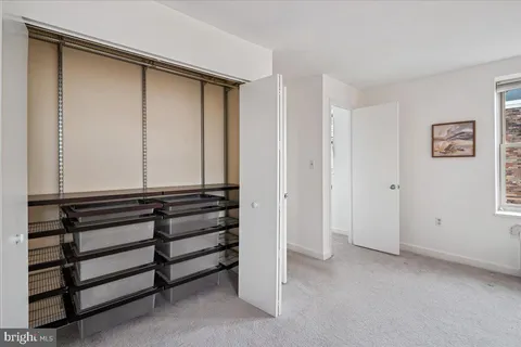 a view of room with window and closet