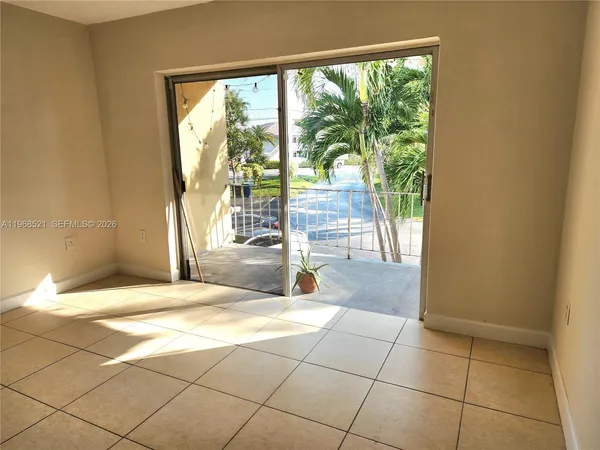 a view of an empty room with a window