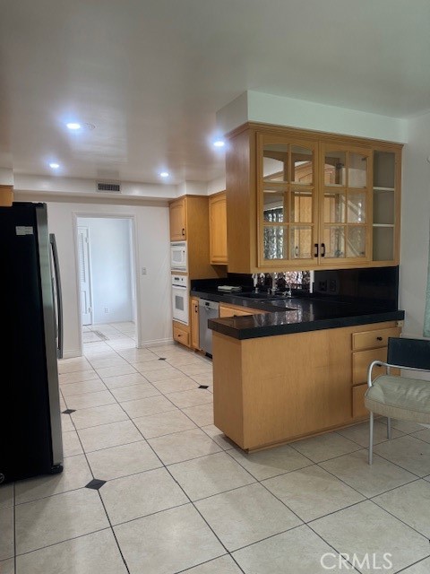 1200 West Rowan Street Anaheim, CA 92801 - Photo 20 of 20 a kitchen with granite countertop a refrigerator and a sink
