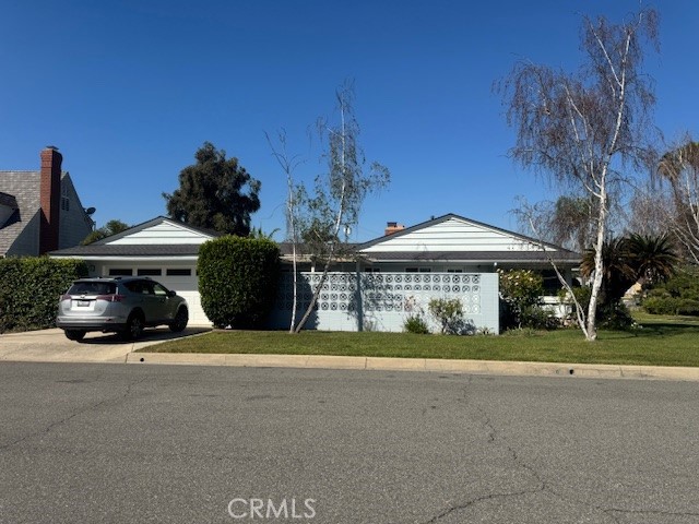 1200 West Rowan Street Anaheim, CA 92801 - Photo 2 of 20 a view of a house with large space and a car parked in front of it