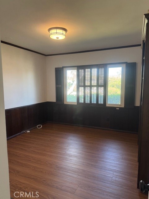 1200 West Rowan Street Anaheim, CA 92801 - Photo 6 of 20 an empty room with wooden floor and windows
