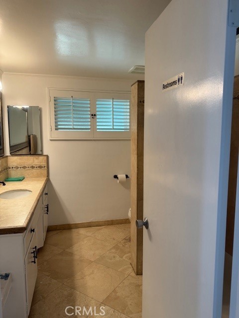 1200 West Rowan Street Anaheim, CA 92801 - Photo 9 of 20 a bathroom with a sink and a mirror