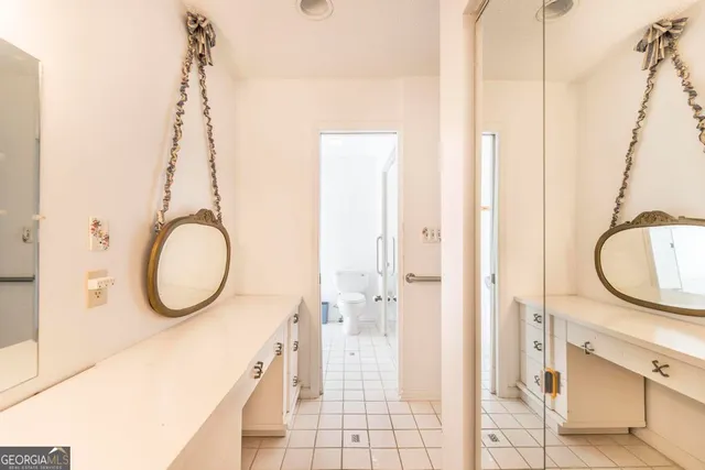 a bathroom with a sink a mirror and a shower