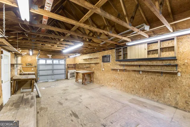 a view of an empty room with wooden walls