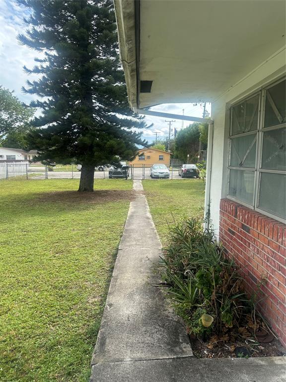 5925 Southwest 27th Street, Unit 1 West Park, FL 33023 - Photo 3 of 12 a view of a garden