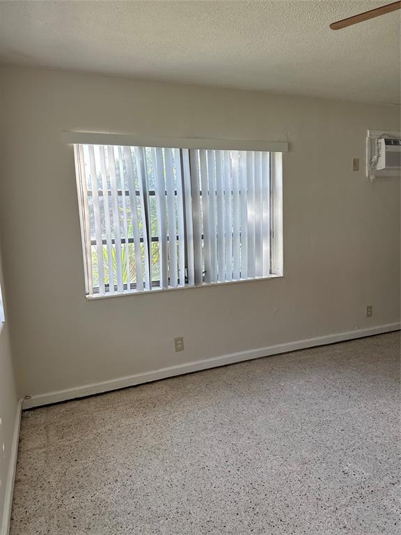 5925 Southwest 27th Street, Unit 1 West Park, FL 33023 - Photo 4 of 12 an empty room with windows