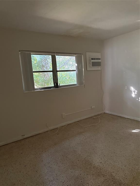 5925 Southwest 27th Street, Unit 1 West Park, FL 33023 - Photo 7 of 12 an empty room with a window
