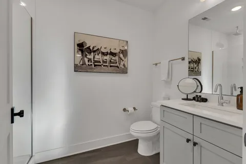a bathroom with a toilet sink and vanity