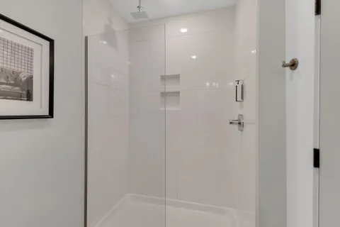 a bathroom with a shower and a sink