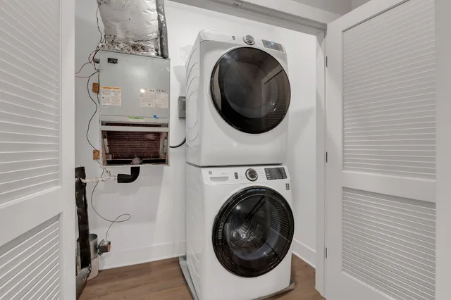 a view of a hallway with washer and dryer