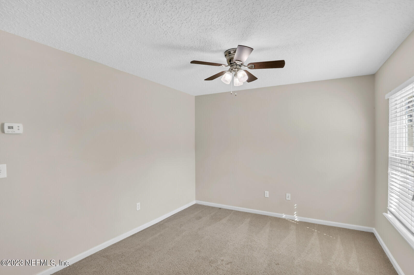 1810 Biscayne Bay Circle Jacksonville, FL 32218 - Photo 11 of 15 a view of room with hardwood floor and window