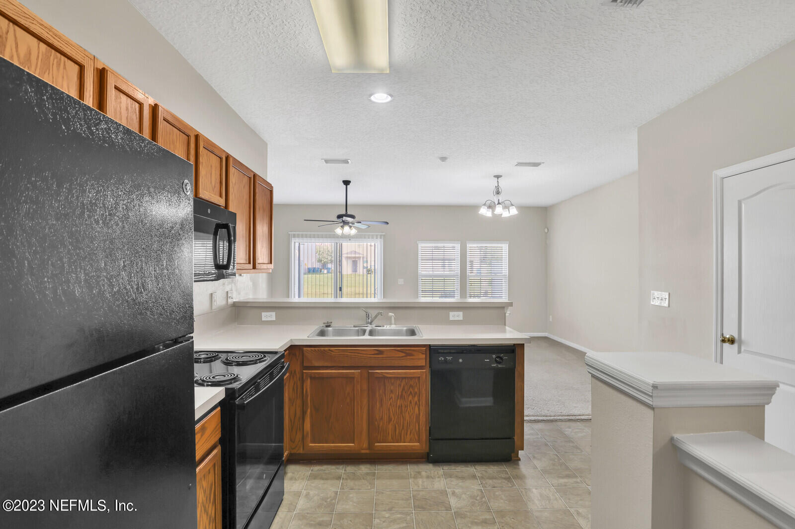 1810 Biscayne Bay Circle Jacksonville, FL 32218 - Photo 2 of 15 a kitchen with a sink stove and cabinets