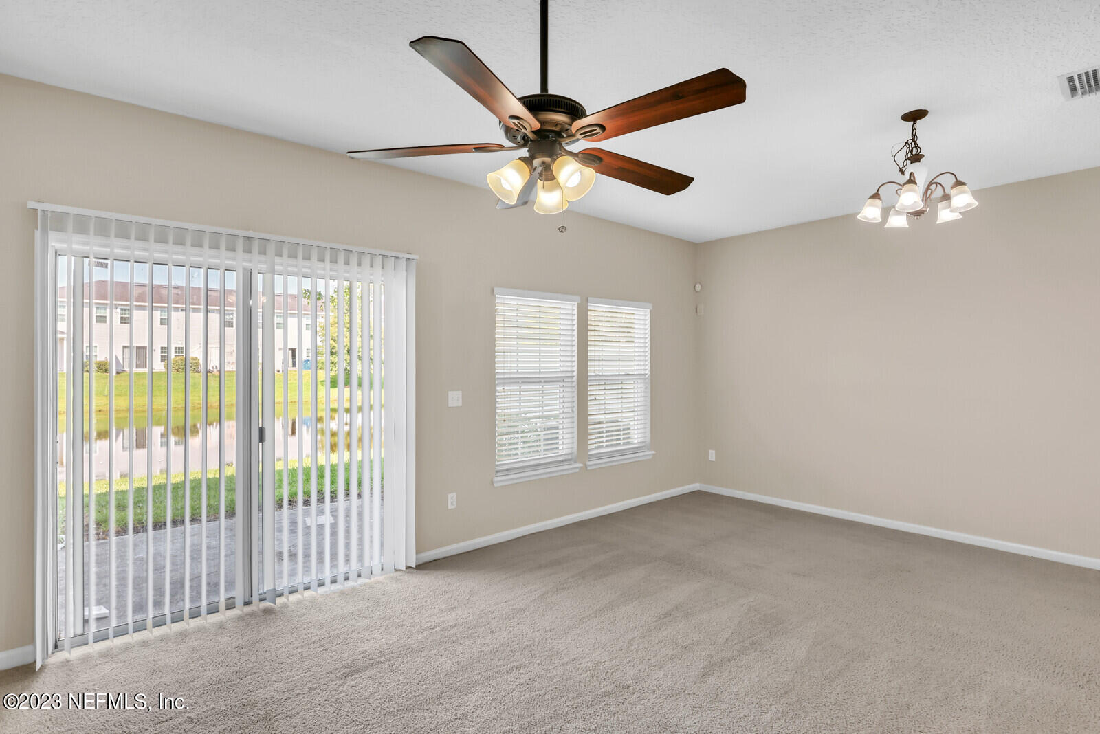 1810 Biscayne Bay Circle Jacksonville, FL 32218 - Photo 5 of 15 a view of a livingroom with a ceiling fan and a large window