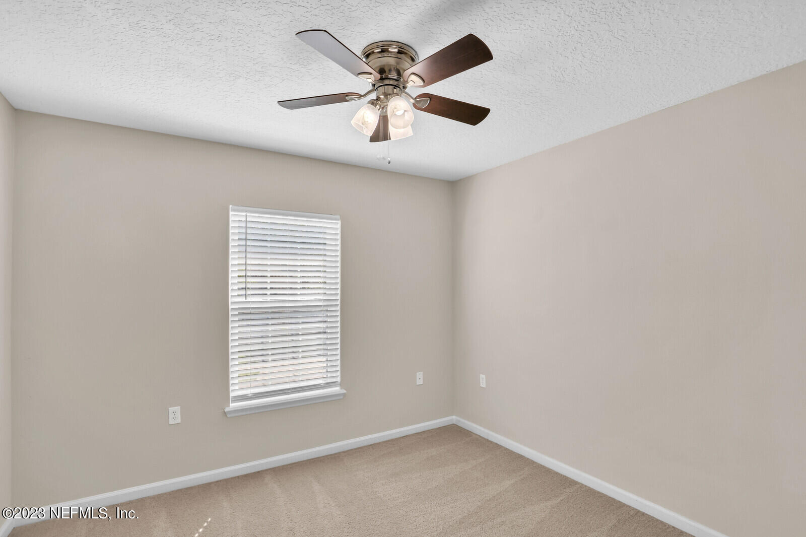 1810 Biscayne Bay Circle Jacksonville, FL 32218 - Photo 10 of 15 a view of an empty room with a window