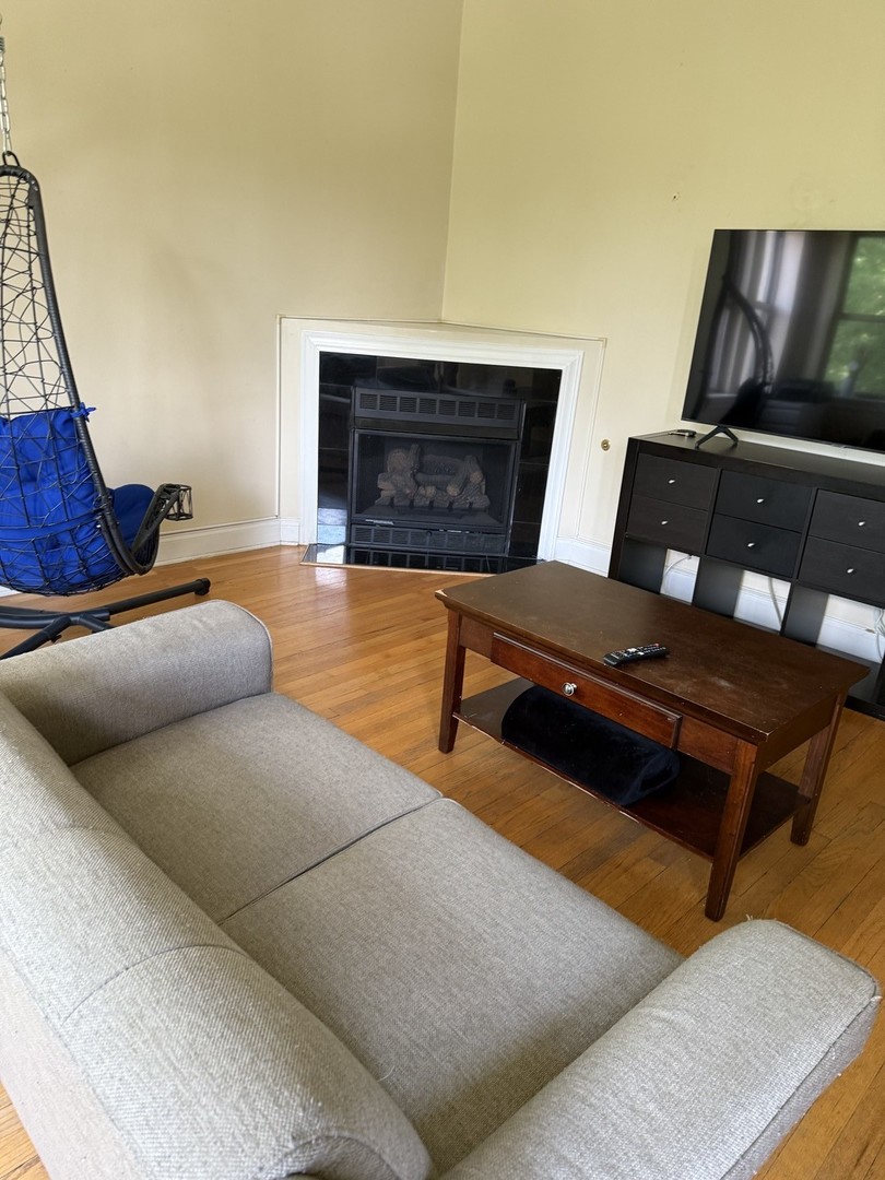 4027 West Crystal Street, Unit 2 Chicago, IL 60651 - Photo 5 of 14 a living room with furniture and a couch