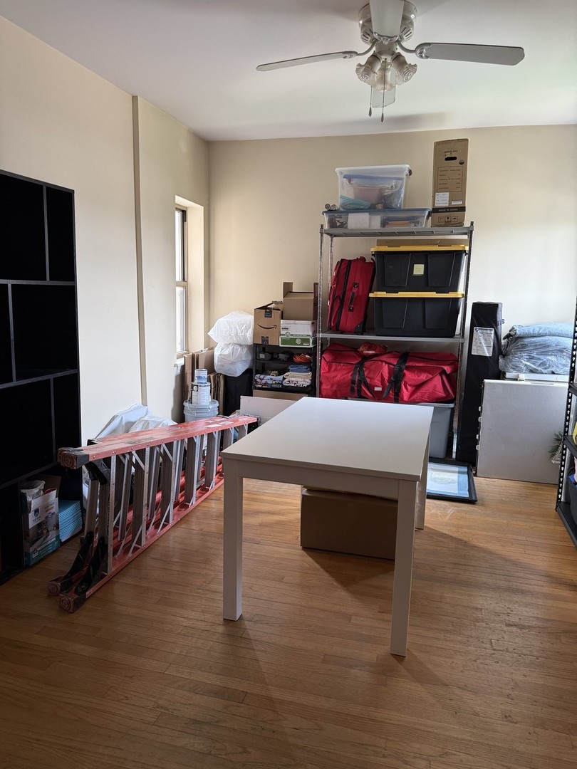 4027 West Crystal Street, Unit 2 Chicago, IL 60651 - Photo 10 of 14 a living room with furniture and a flat screen tv