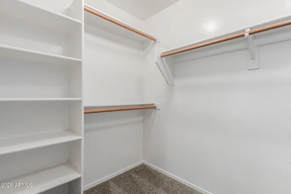 a view of an empty walk in closet