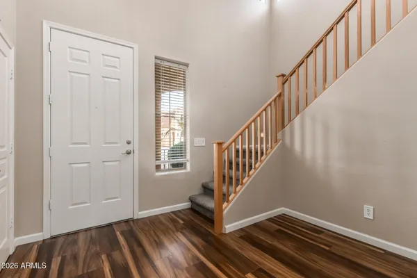 a view of an entryway with wooden floor