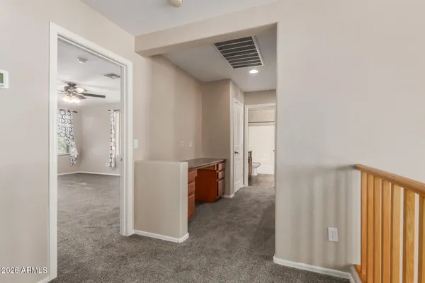 a view of a hallway with bathroom