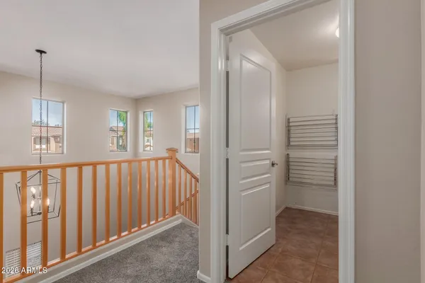 a view of a hallway with windows