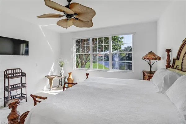 a bedroom with furniture and a window