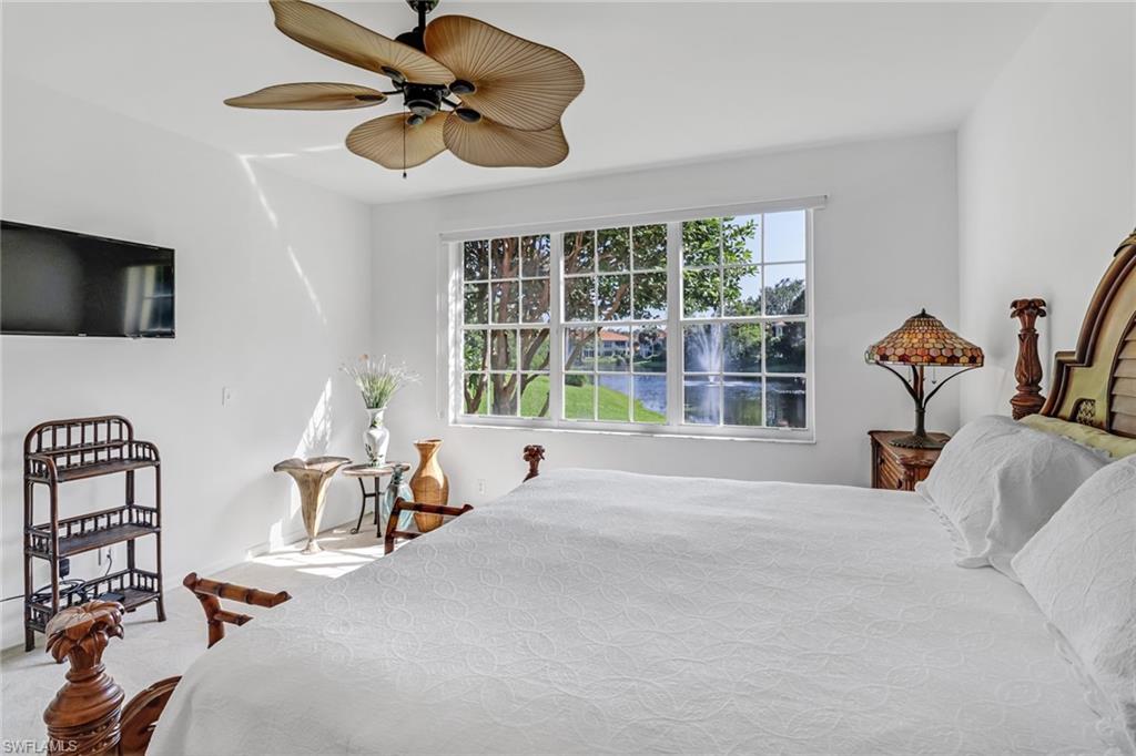 1301 Egrets Landing, Unit 101 Naples, FL 34108 - Photo 17 of 25 a bedroom with furniture and a window
