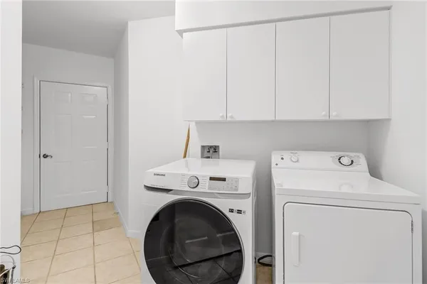 a view of storage and utility room with washer and dryer