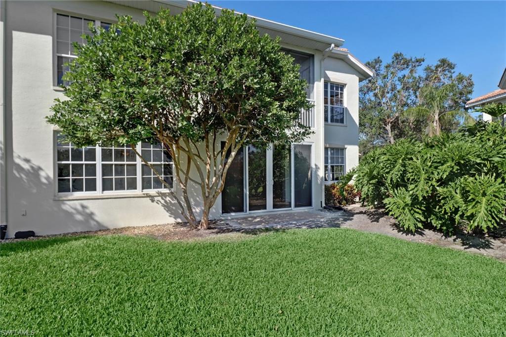 1301 Egrets Landing, Unit 101 Naples, FL 34108 - Photo 24 of 25 a view of outdoor space yard and house