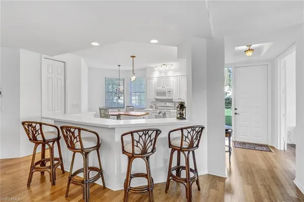 a kitchen with a table and chairs in it