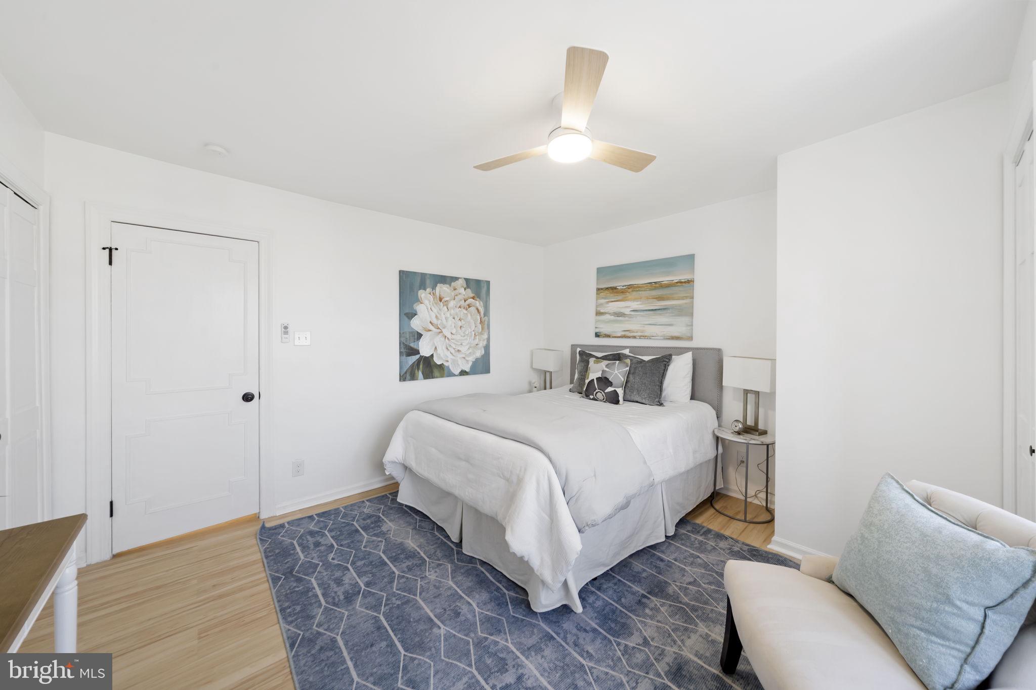 2517 Marshall Road Drexel Hill, PA 19026 - Photo 21 of 29 a bedroom with a large bed and a chandelier