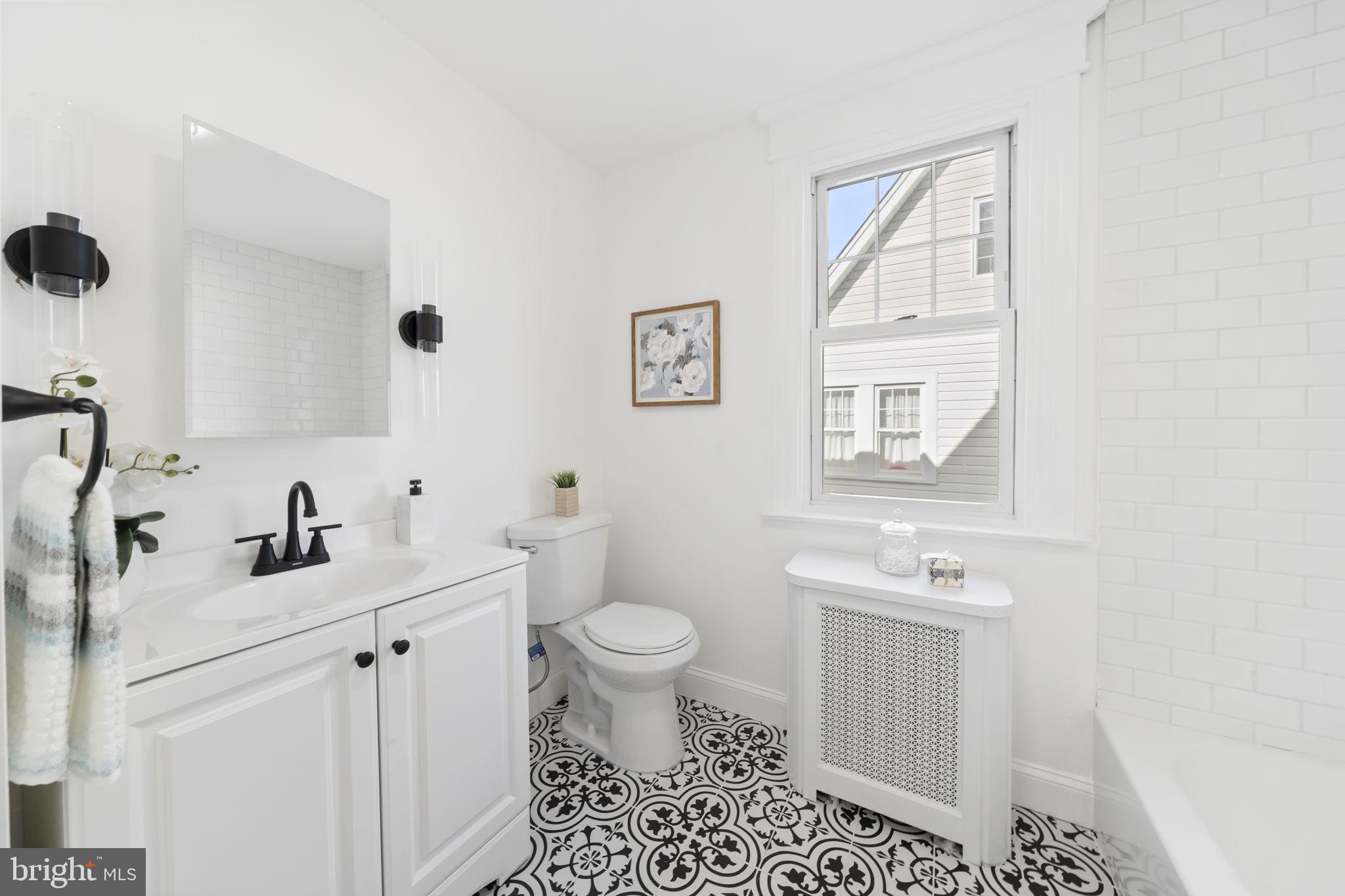 2517 Marshall Road Drexel Hill, PA 19026 - Photo 23 of 29 a bathroom with a sink a toilet and a mirror