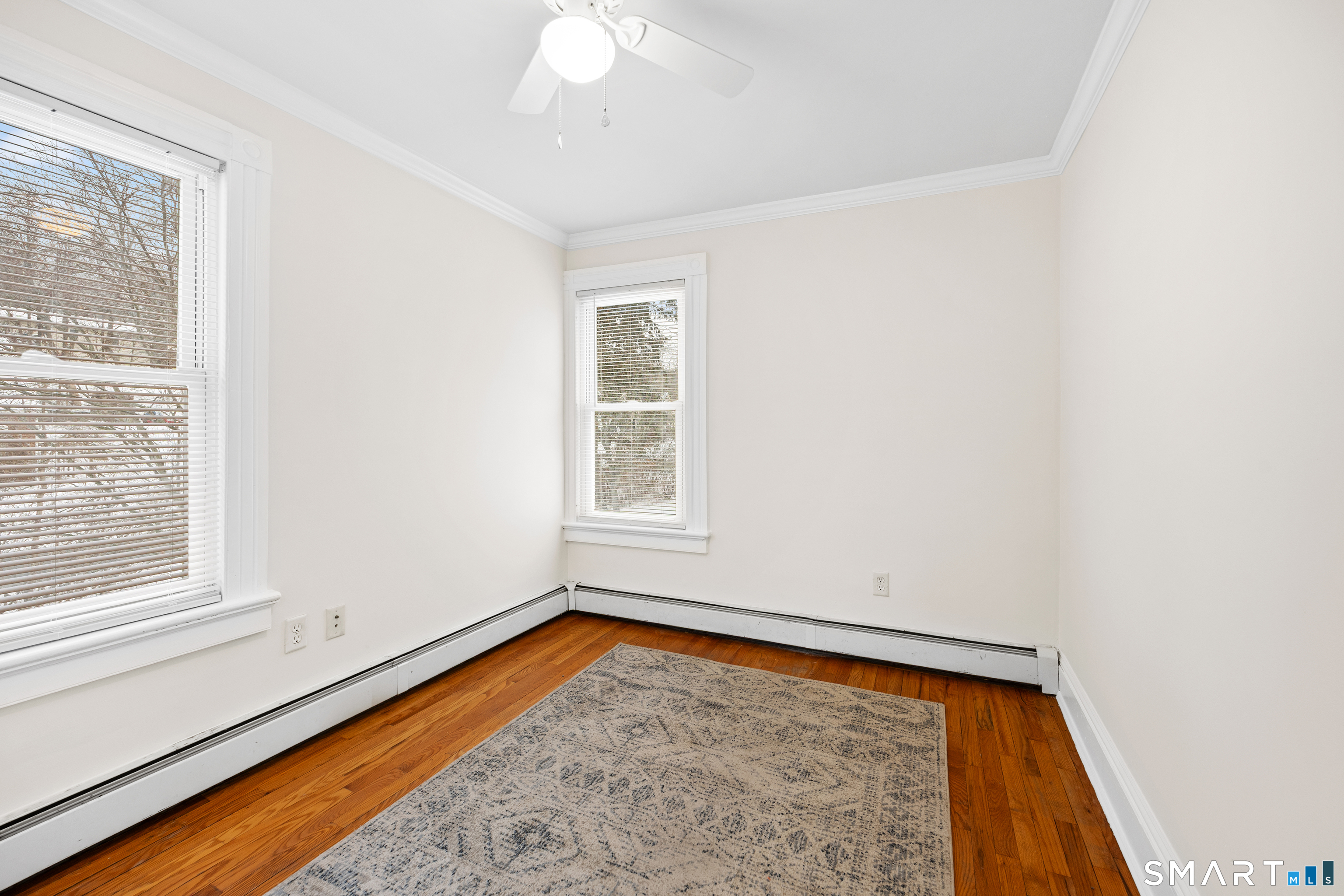 60 Guilford Street Torrington, CT 06790 - Photo 15 of 27 a view of room with window and wooden floor