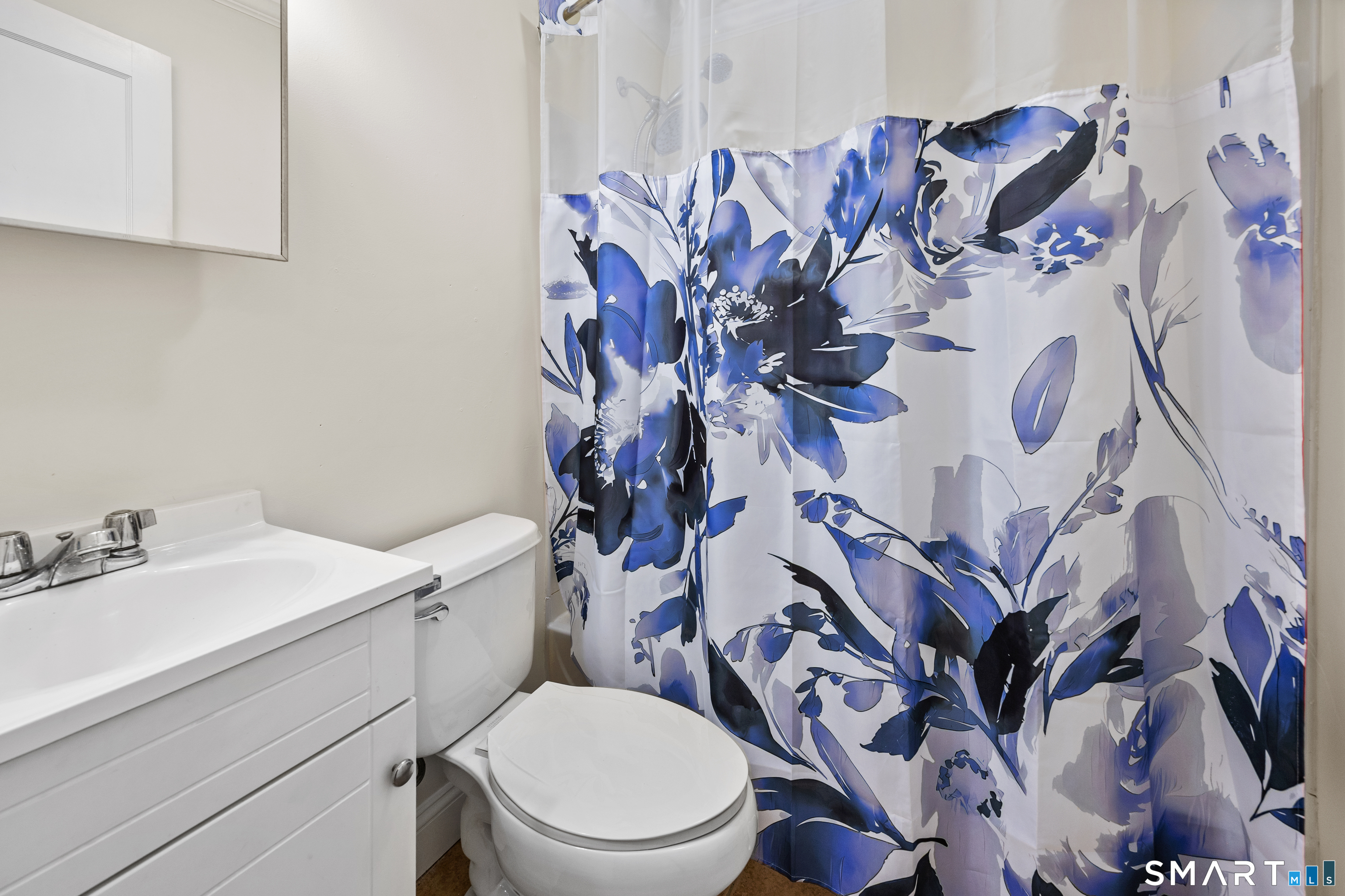 60 Guilford Street Torrington, CT 06790 - Photo 20 of 27 a bathroom with a sink and mirror with toilet