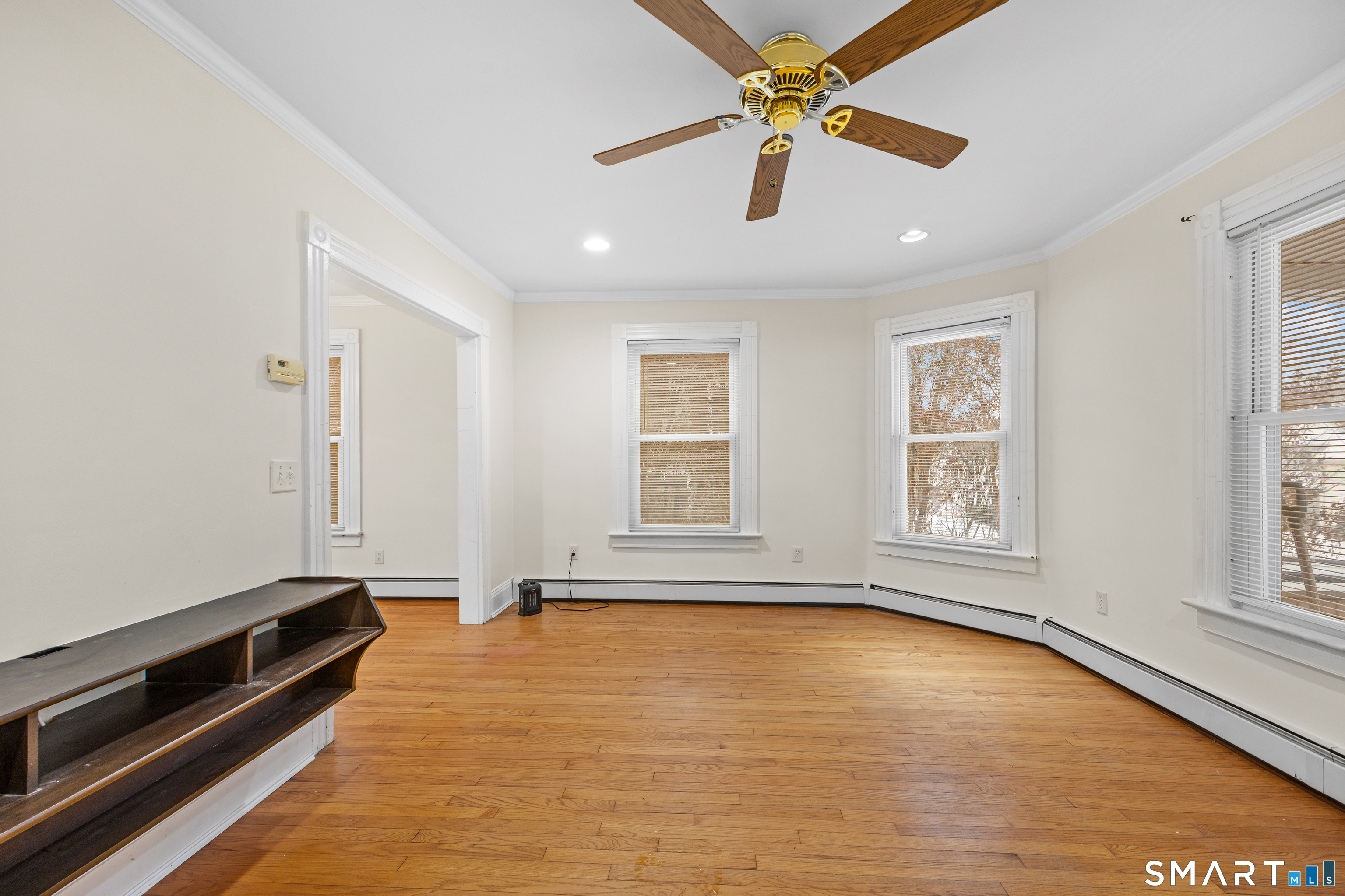 60 Guilford Street Torrington, CT 06790 - Photo 4 of 27 wooden floor in an empty room with a window