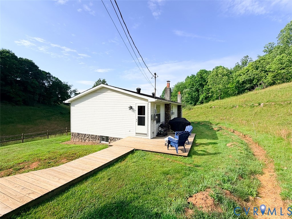 453 Long Hollow Road Cleveland, VA 24225 - Photo 13 of 50 a backyard of a house with seating space