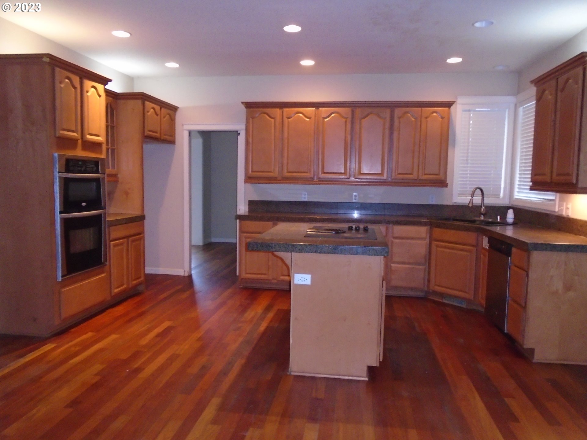 1710 South Dusky Drive Ridgefield, WA 98642 - Photo 4 of 16 a kitchen with stainless steel appliances granite countertop a stove a sink and a refrigerator