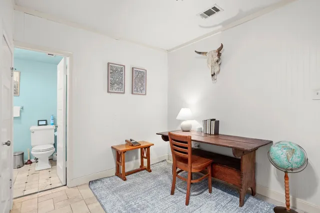 a room with a table and chairs