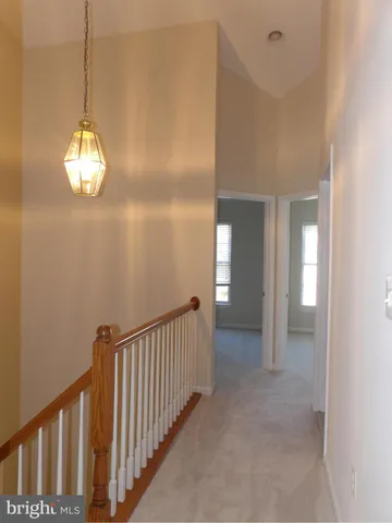 a view of a hallway view with staircase