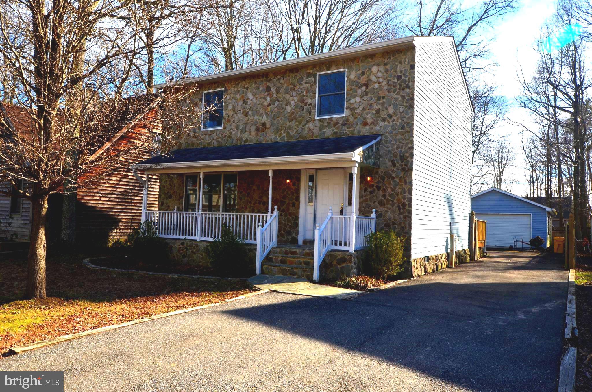 723 Tyler Point Road Deale, MD 20751 - Photo 1 of 35 a front view of a house with a yard