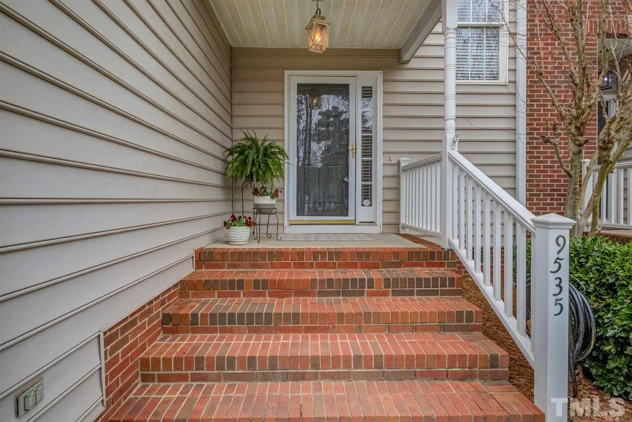 9535 Hanging Rock Road Raleigh, NC 27613 - Photo 2 of 27 a view of balcony with door and wooden floor