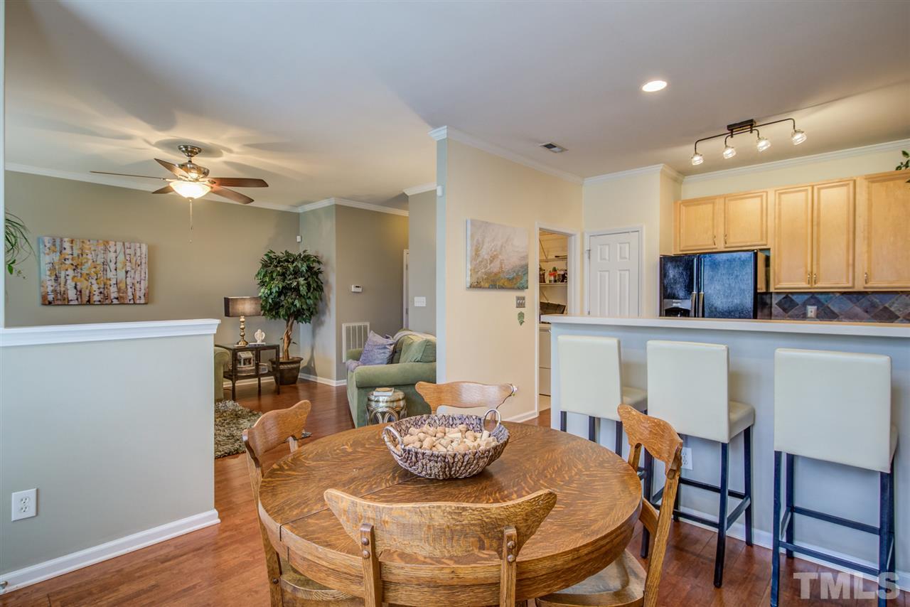 9535 Hanging Rock Road Raleigh, NC 27613 - Photo 13 of 27 a view of a dining room with furniture and wooden floor