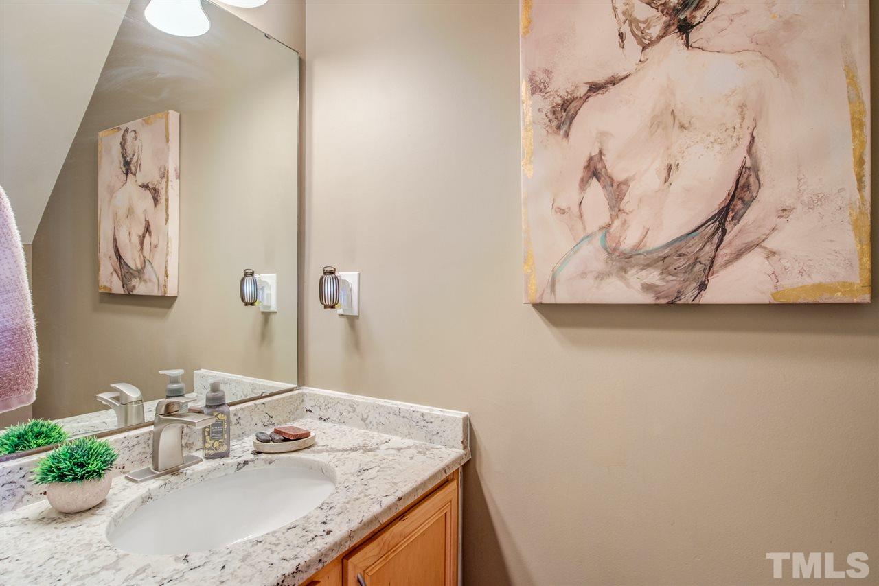 9535 Hanging Rock Road Raleigh, NC 27613 - Photo 14 of 27 a bathroom with a granite countertop sink and a mirror