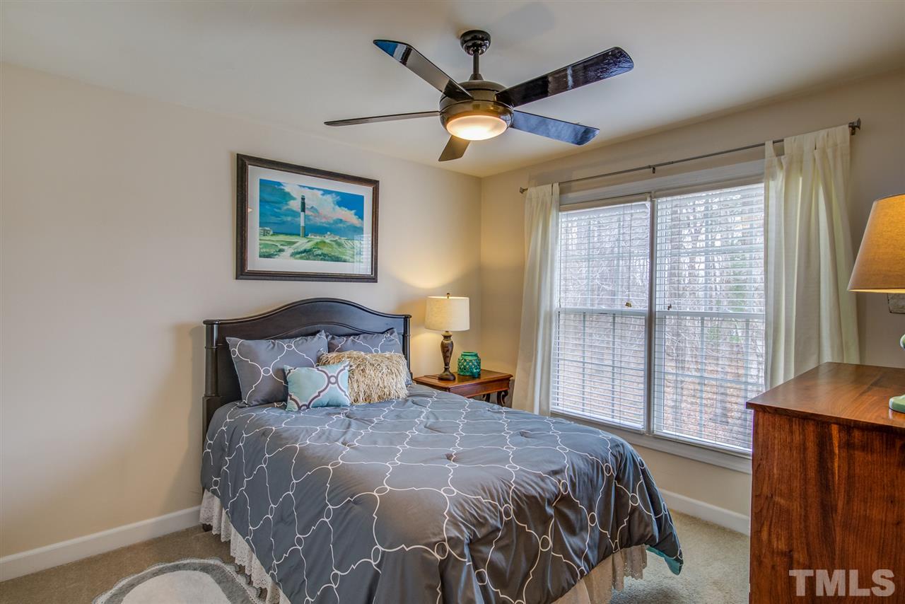 9535 Hanging Rock Road Raleigh, NC 27613 - Photo 18 of 27 a bedroom with a large bed and a window