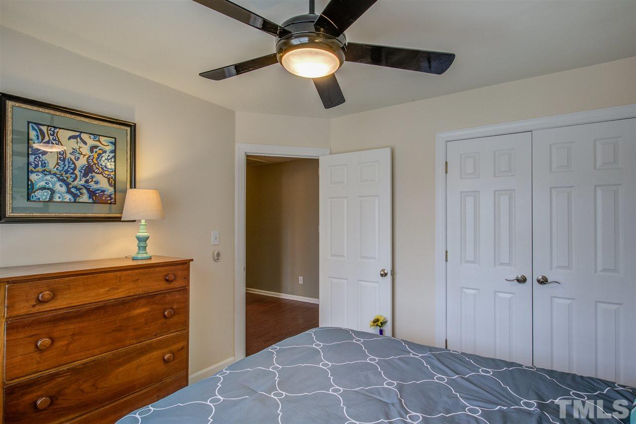 9535 Hanging Rock Road Raleigh, NC 27613 - Photo 19 of 27 a view of a hallway with closet and cabinet