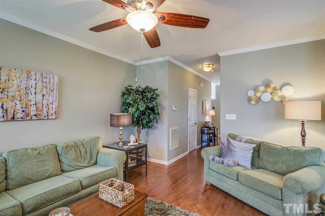 9535 Hanging Rock Road Raleigh, NC 27613 - Photo 7 of 27 a living room with furniture and a potted plant