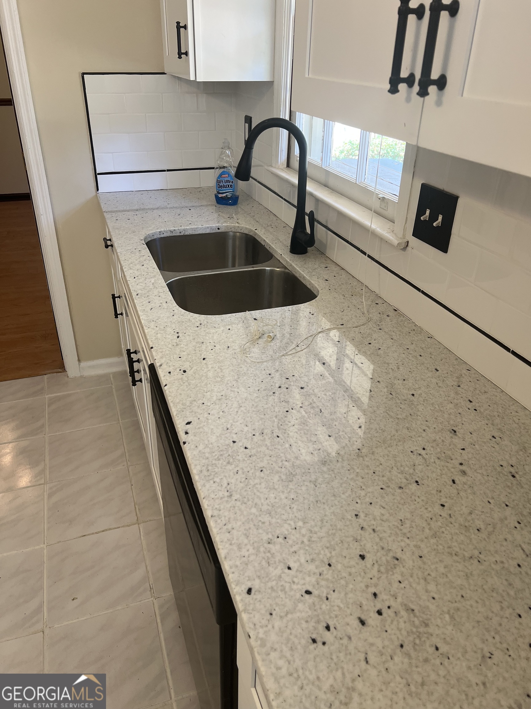 4910 Thompson Mill Road Lithonia, GA 30038 - Photo 16 of 28 a close view of sink and tap