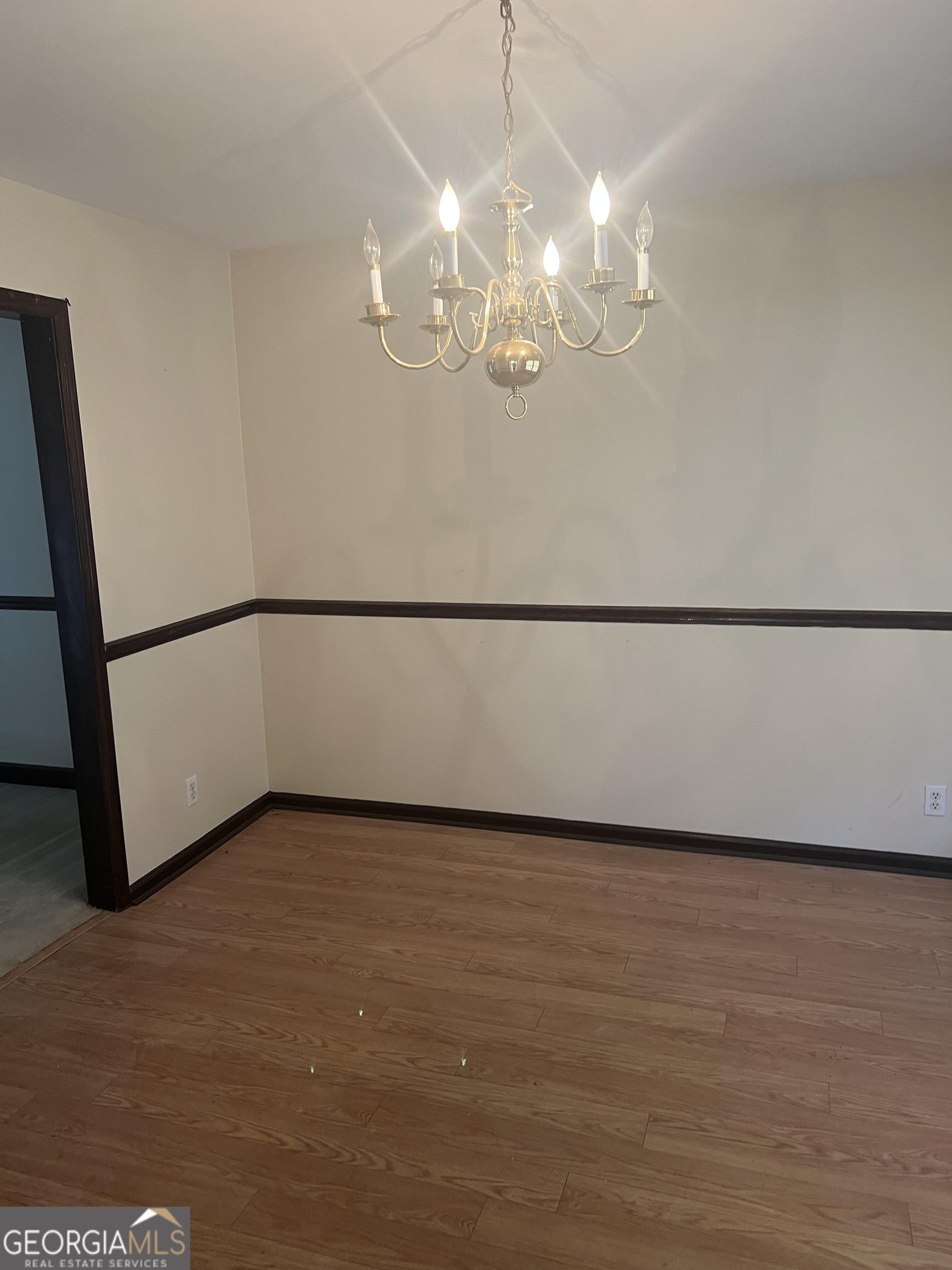 4910 Thompson Mill Road Lithonia, GA 30038 - Photo 17 of 28 a view of a chandelier fan in big room