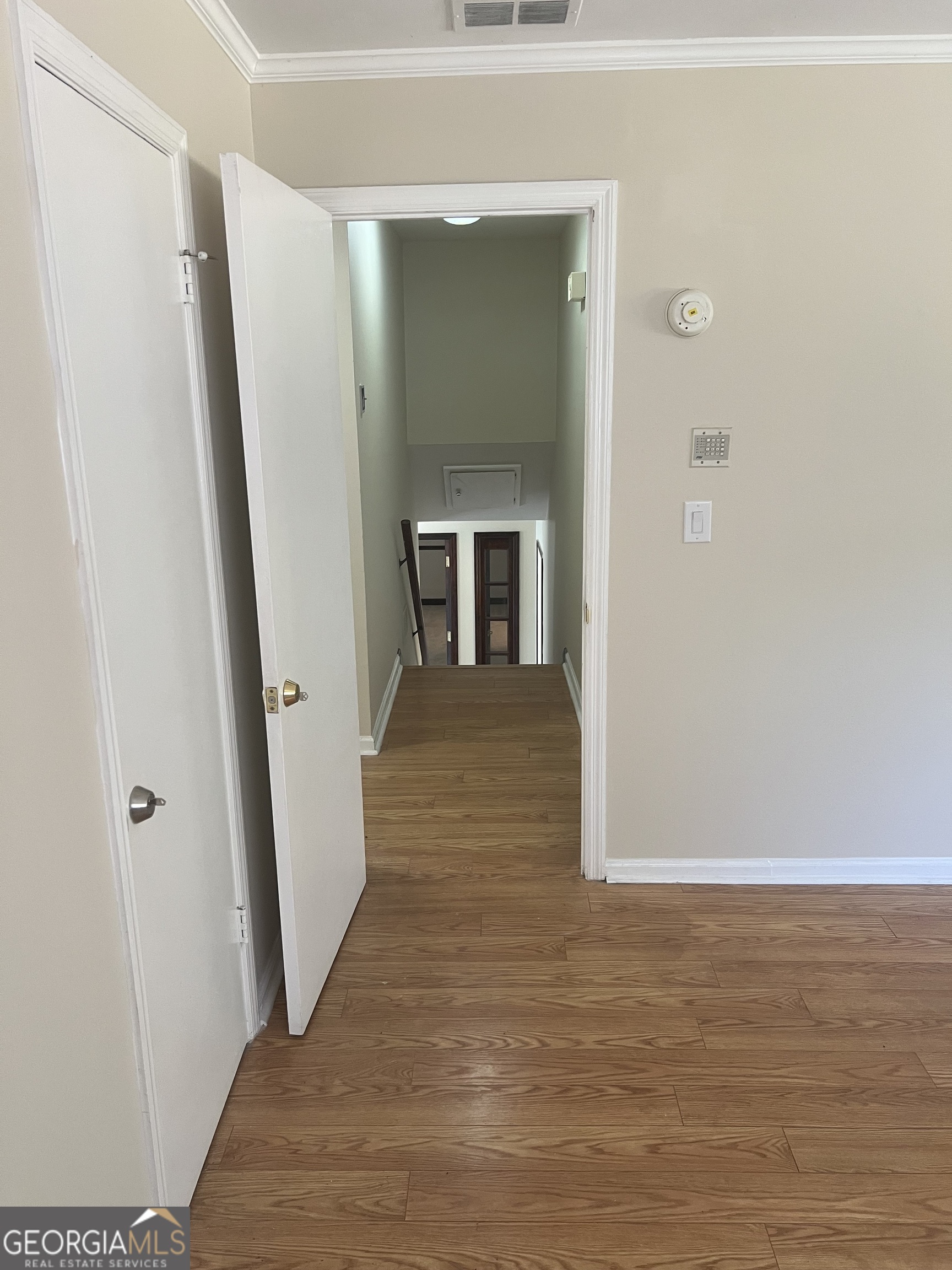 4910 Thompson Mill Road Lithonia, GA 30038 - Photo 20 of 28 a view of a hallway with wooden floor and staircase