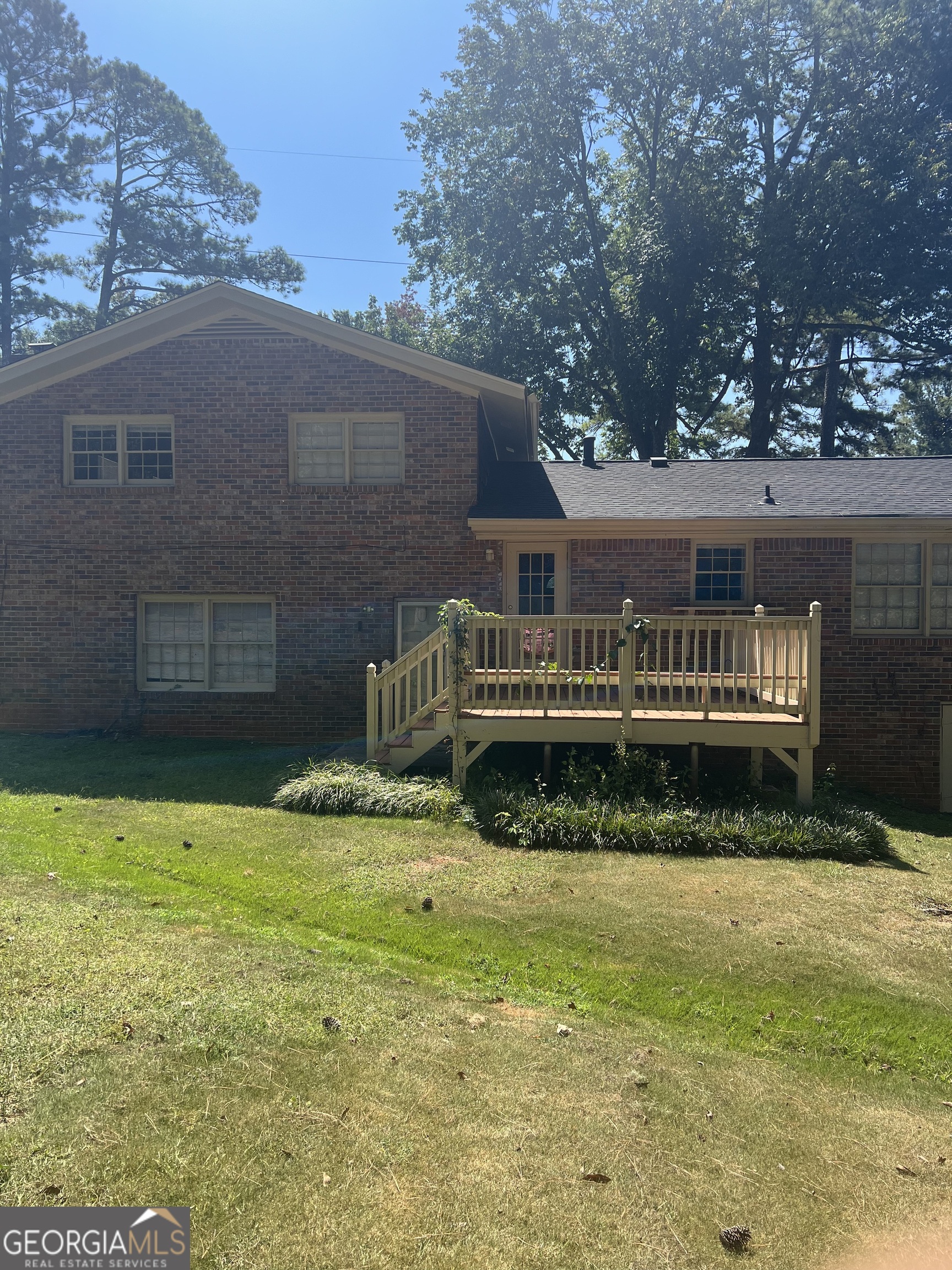 4910 Thompson Mill Road Lithonia, GA 30038 - Photo 2 of 28 a view of a house with a yard